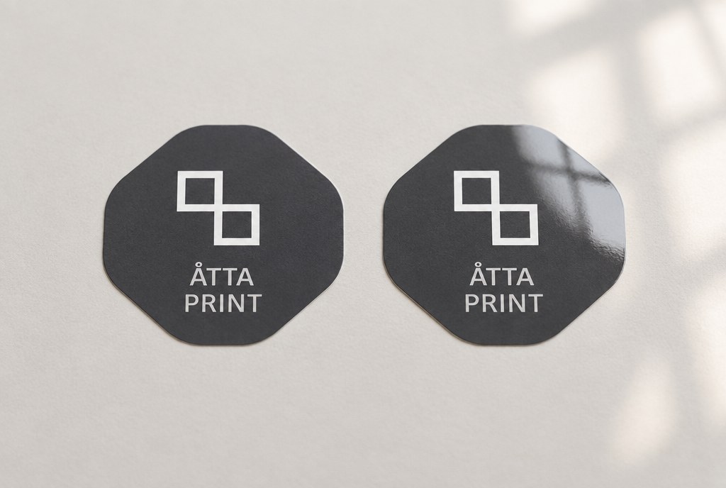 Matte and gloss stickers placed side by side showing the difference in glare